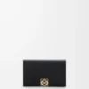 Anagram business cardholder in pebble grained calfskin Black/Gold