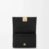 Anagram business cardholder in pebble grained calfskin Black/Gold