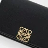 Anagram business cardholder in pebble grained calfskin Black/Gold