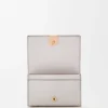 Anagram business cardholder in pebble grained calfskin Light Ghost Grey