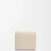 Anagram compact flap wallet in pebble grained calfskin Light Ghost