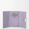 Anagram key case in pebble grained calfskin Dirty Mauve