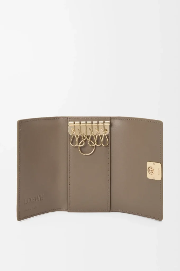 Anagram key case in pebble grained calfskin Taupe Anagram key case in pebble grained calfskin Taupe