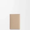 Anagram small vertical wallet in pebble grained calfskin Sand