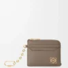 Anagram square coin cardholder in pebble grained calfskin Taupe Anagram square coin cardholder in pebble grained calfskin Taupe