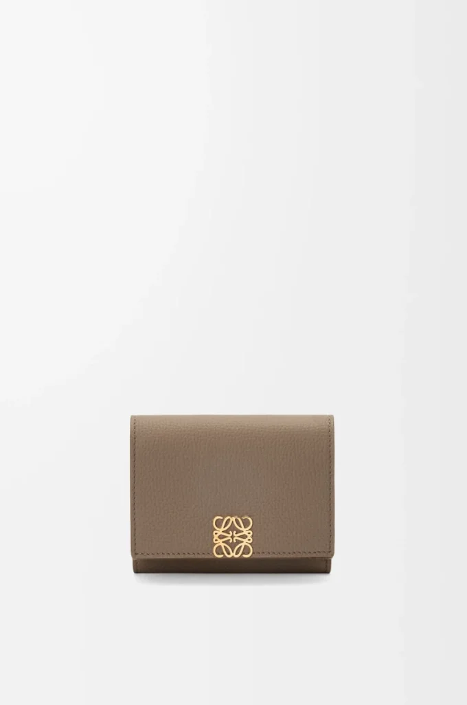 Anagram trifold wallet in pebble grained calfskin Taupe Anagram trifold wallet in pebble grained calfskin Taupe