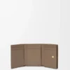 Anagram trifold wallet in pebble grained calfskin Taupe Anagram trifold wallet in pebble grained calfskin Taupe