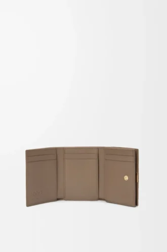Anagram trifold wallet in pebble grained calfskin Taupe