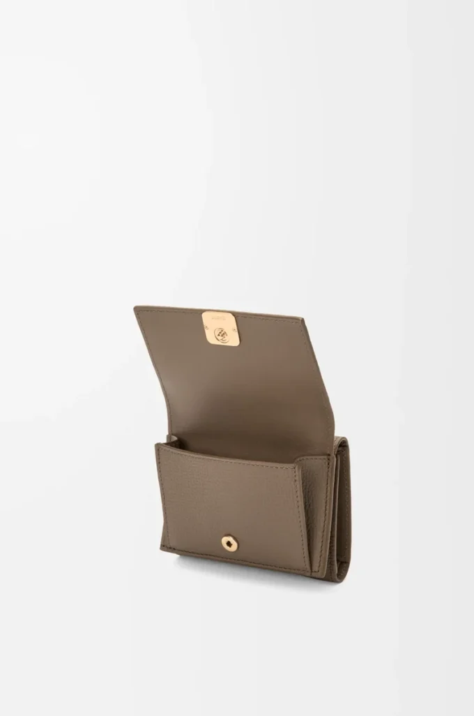 Anagram trifold wallet in pebble grained calfskin Taupe Anagram trifold wallet in pebble grained calfskin Taupe