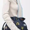 Cats medium Flamenco clutch in embroidered denim Blue