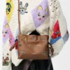 Cats mini Flamenco clutch in nappa calfskin Mocha