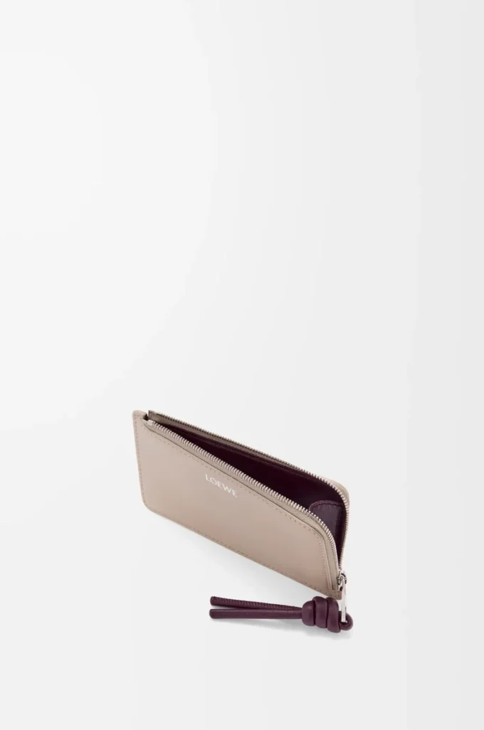 Knot coin cardholder in shiny nappa calfskin Clay/Plum Knot coin cardholder in shiny nappa calfskin Clay/Plum