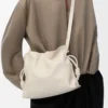 Medium Flamenco clutch in nappa calfskin Sea Salt