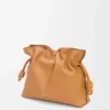 Medium Flamenco clutch in nappa calfskin Warm Desert