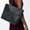 Medium horizontal Puzzle Fold tote in soft grained calfskin Black