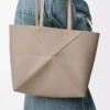 Medium horizontal Puzzle Fold tote in soft grained calfskin Clay
