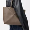 Medium horizontal Puzzle Fold tote in soft grained calfskin Taupe