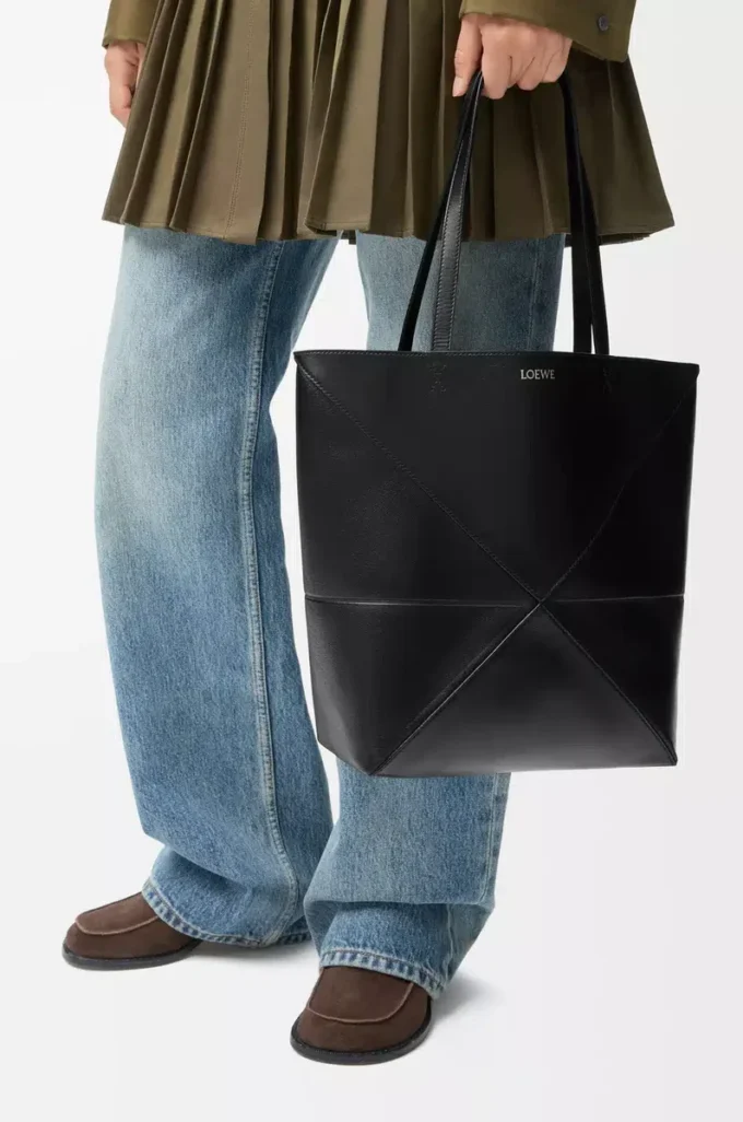 Medium Puzzle Fold tote in shiny calfskin Black Medium Puzzle Fold tote in shiny calfskin Black
