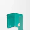 Pebble small vertical wallet in pebble grained calfskin Aquamarine