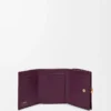 Pebble trifold wallet in pebble grain calfskin Plum