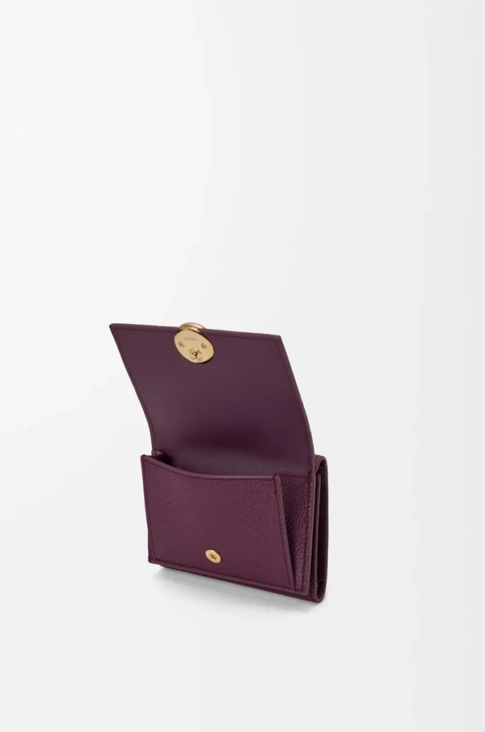Pebble trifold wallet in pebble grain calfskin Plum
