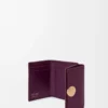 Pebble trifold wallet in pebble grain calfskin Plum