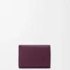 Pebble trifold wallet in pebble grain calfskin Plum