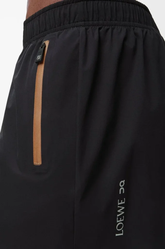 Performance shorts in technical shell Black