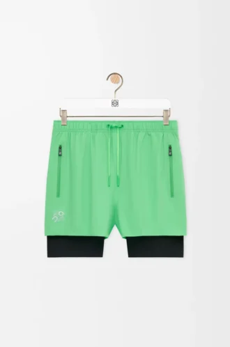 Performance shorts in technical shell Green