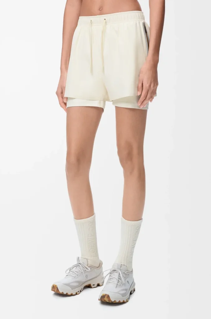 Performance shorts in technical shell Ivory