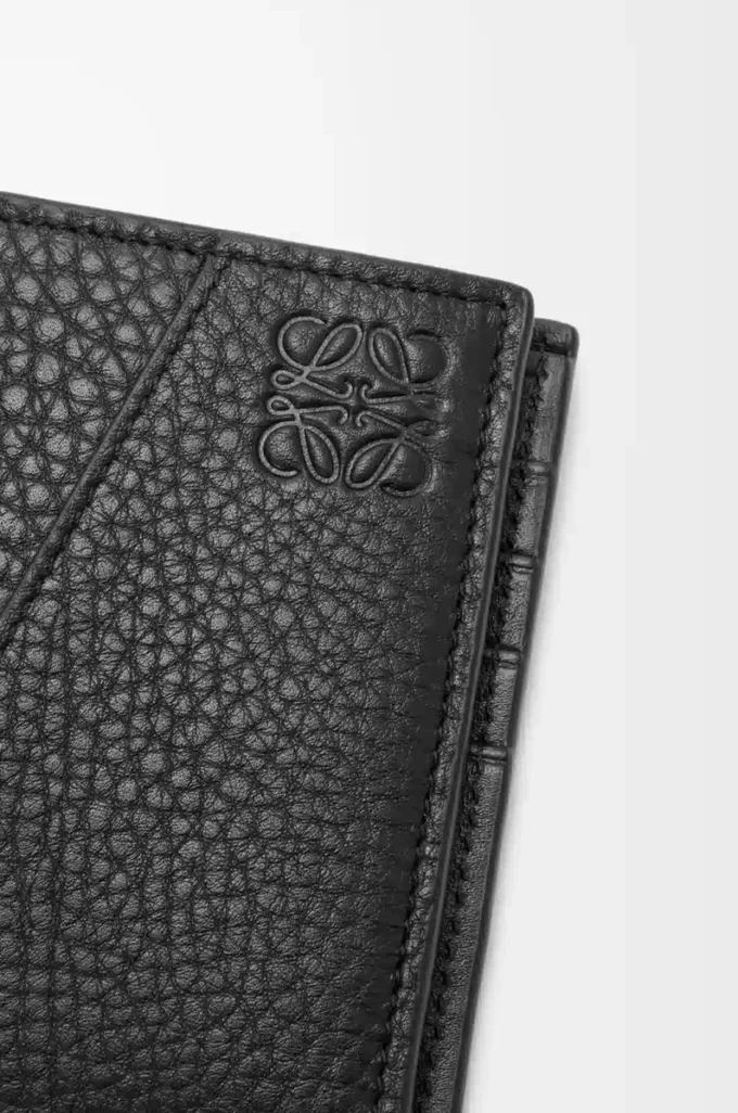 Puzzle bifold coin wallet in supple grained calfskin Black