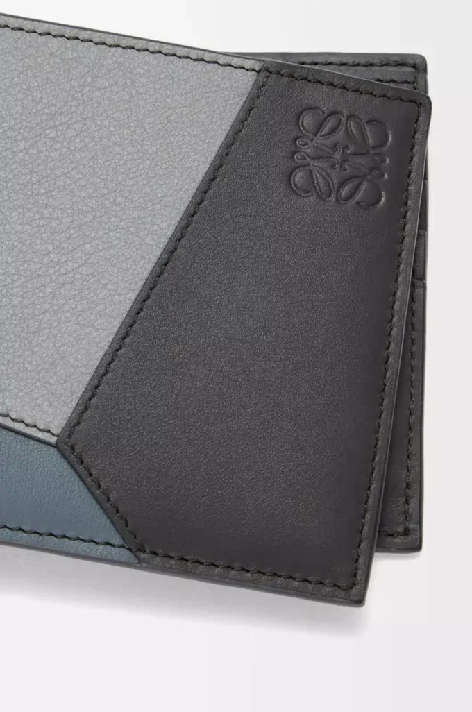 Puzzle bifold wallet in classic calfskin Asphalt Grey/Storm Blue Puzzle bifold wallet in classic calfskin Asphalt Grey/Storm Blue