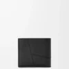 Puzzle bifold wallet in supple grained calfskin Black