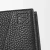 Puzzle bifold wallet in supple grained calfskin Black