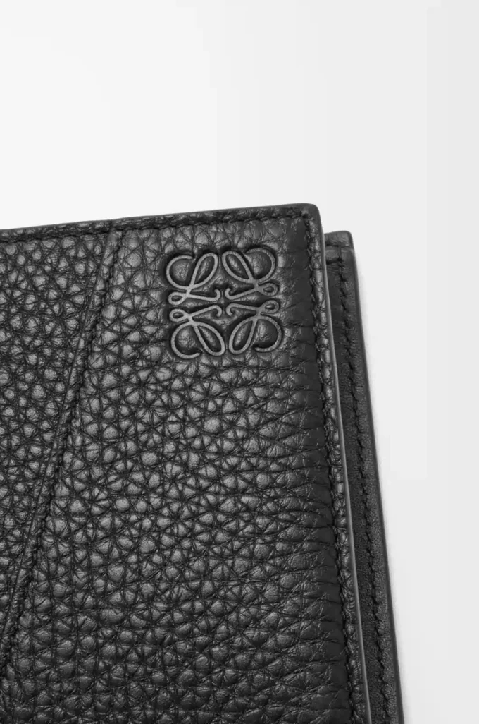 Puzzle bifold wallet in supple grained calfskin Black