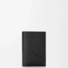 Puzzle passport cover in supple grained calfskin Black Puzzle passport cover in supple grained calfskin Black