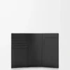 Puzzle passport cover in supple grained calfskin Black Puzzle passport cover in supple grained calfskin Black