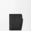 Puzzle slim compact wallet in supple grained calfskin Black