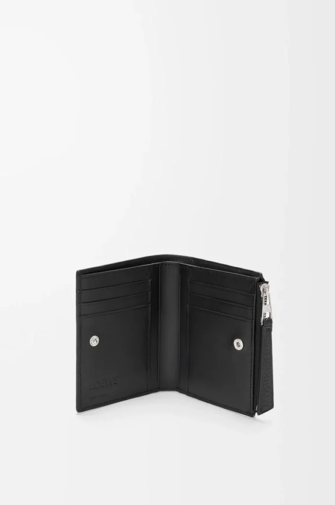 Puzzle slim compact wallet in supple grained calfskin Black