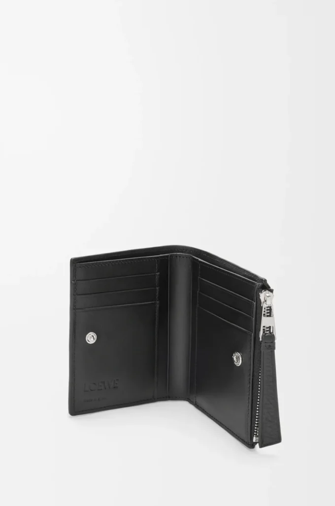 Puzzle slim compact wallet in supple grained calfskin Black