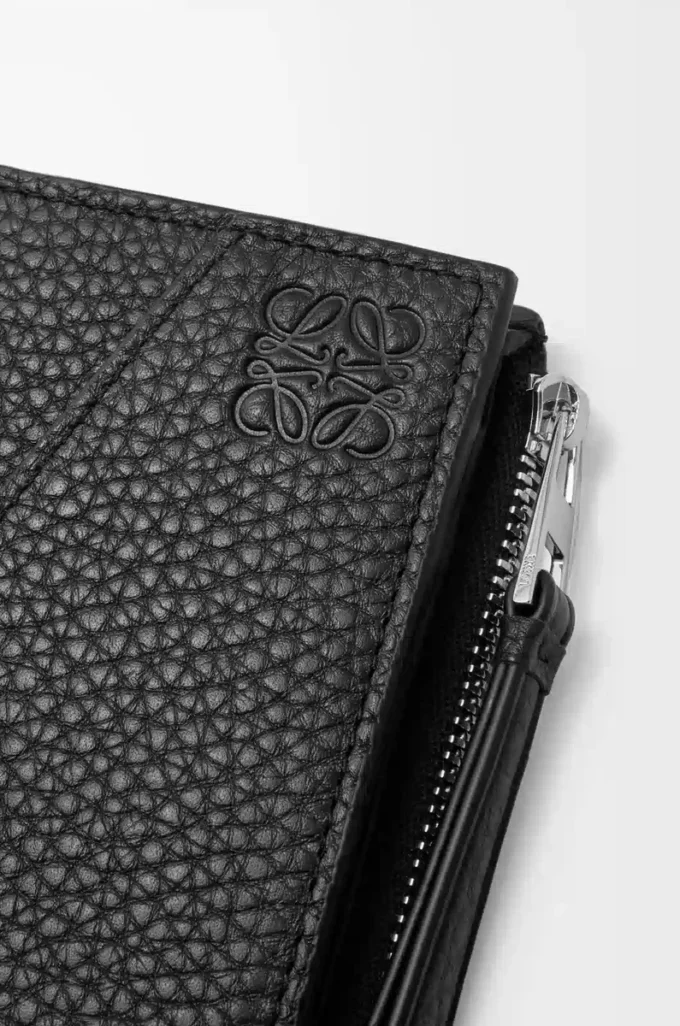 Puzzle slim compact wallet in supple grained calfskin Black