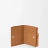 Puzzle slim compact wallet in supple grained calfskin Light Canyon Brown