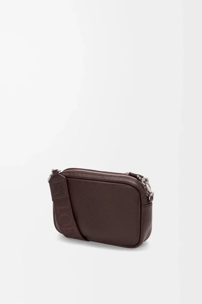 Small Pebble messenger bag in supple grained calfskin Oxblood