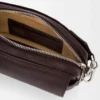 Small Pebble messenger bag in supple grained calfskin Oxblood