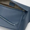 Small Puzzle Edge bumbag in classic calfskin Indigo Dye Small Puzzle Edge bumbag in classic calfskin Indigo Dye